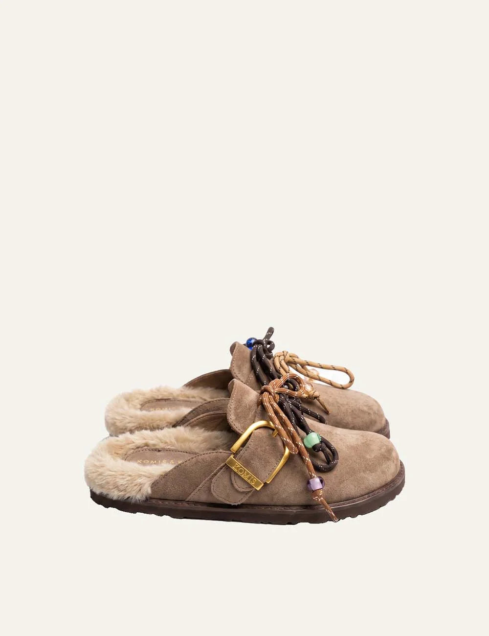 Komis &amp; Komis women's taupe suede fur-lined mules with gold buckle.