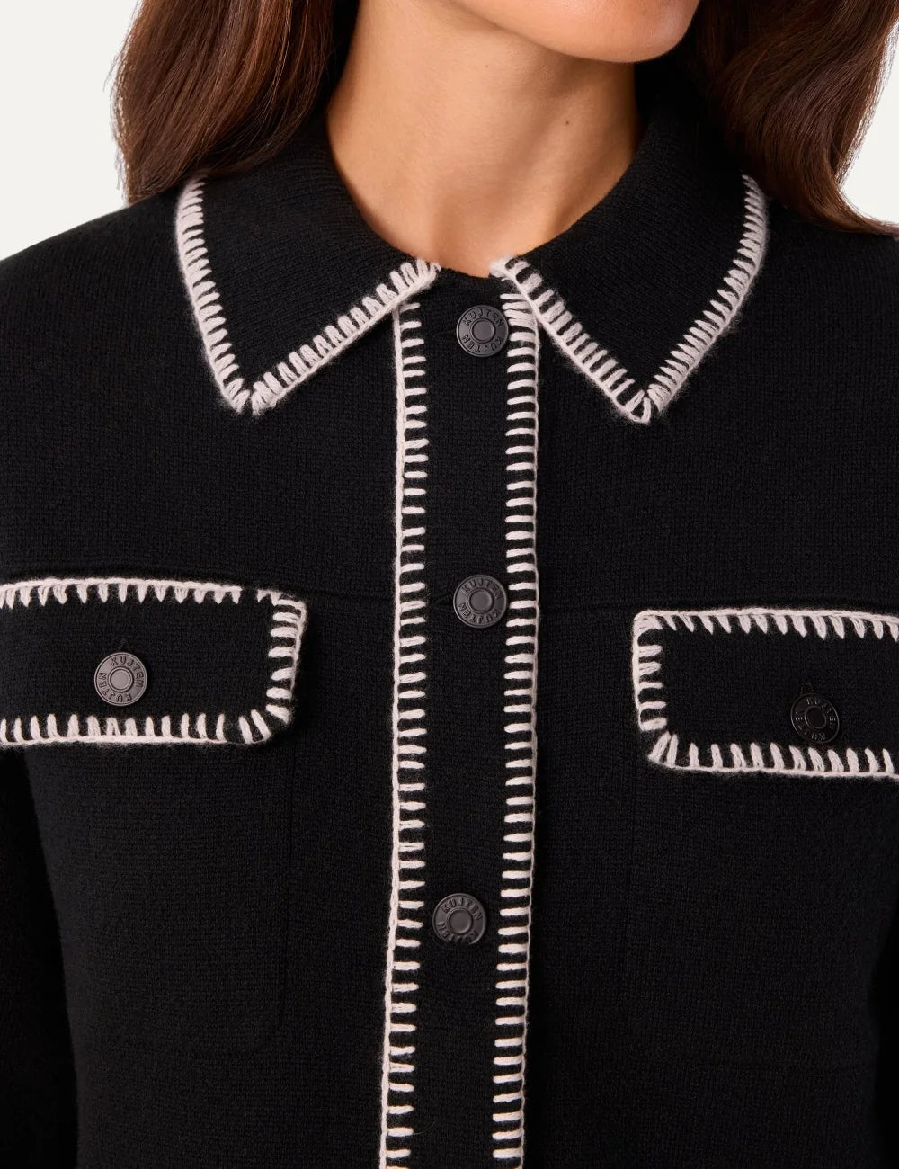 Kujten women Area black cashmere knit jacket with white contrast stitching and shirt collar model