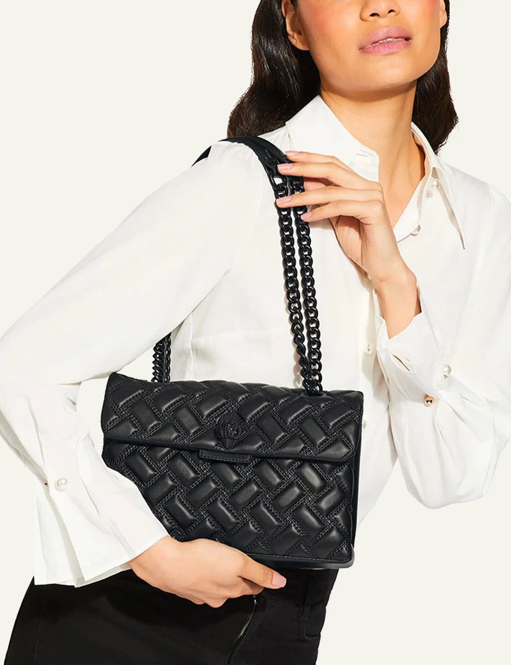 Black leather quilted Kurt Geiger shoulder bag with black chain strap and eagle head clasp model