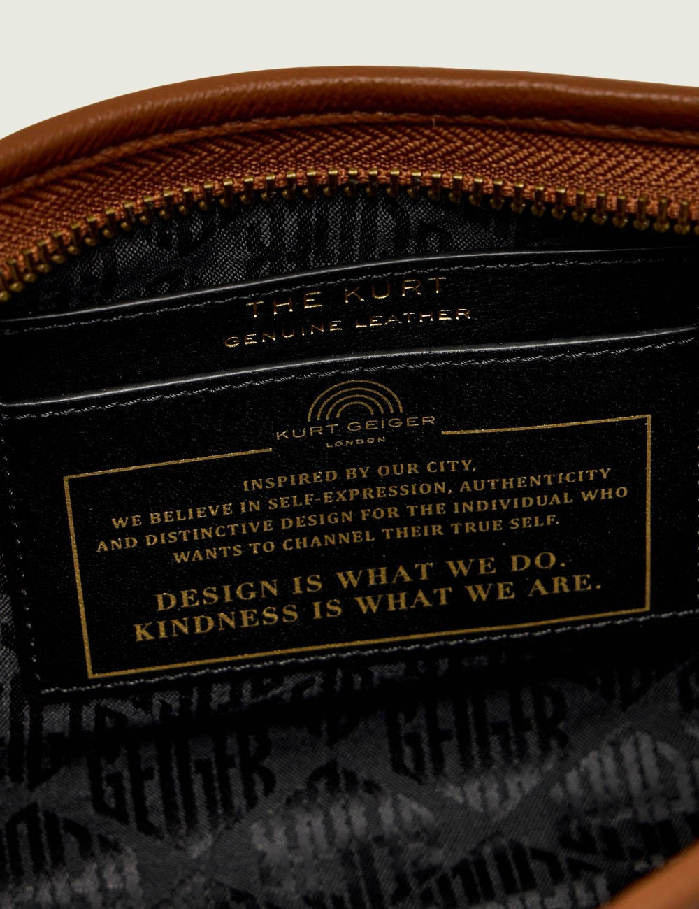 kurt geiger brown leather hobo bag eagle detail buckle strap top detail view