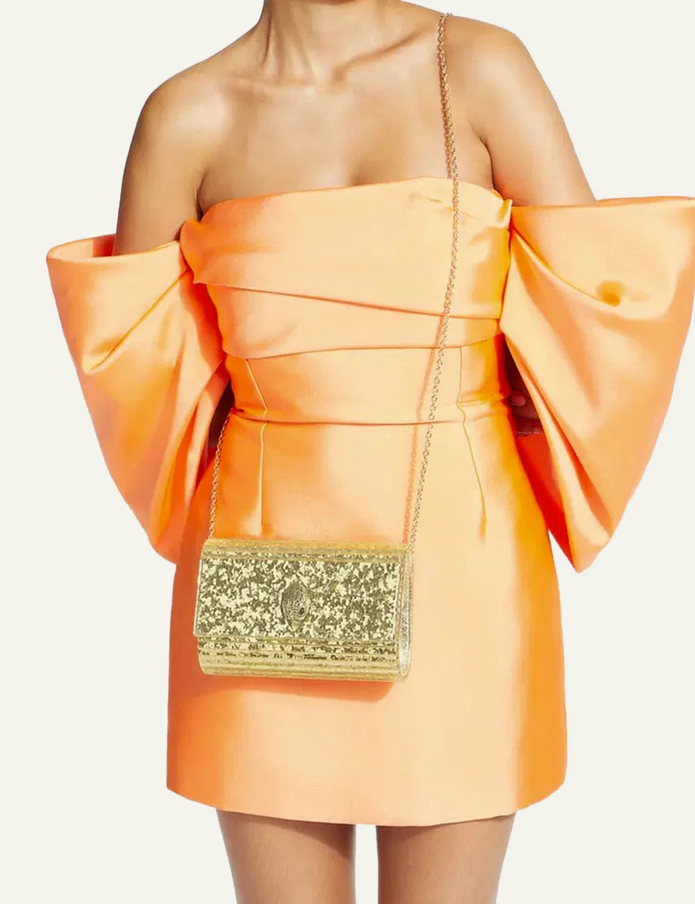 Gold glitter Kurt Geiger clutch bag with eagle head clasp full body