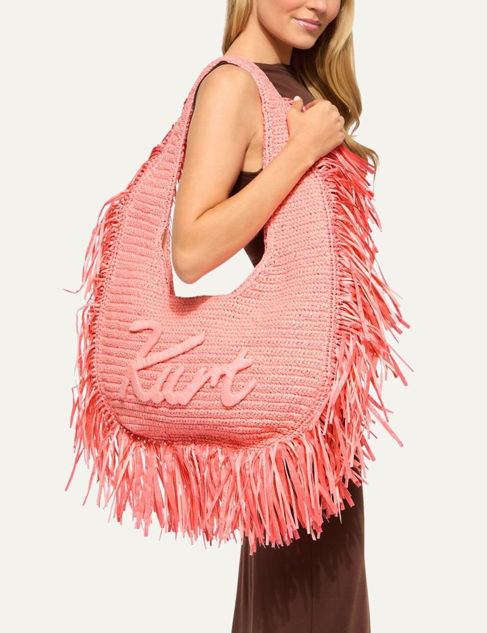 kurt geiger large hobo bag pink raffia fringe cursive logo front model view