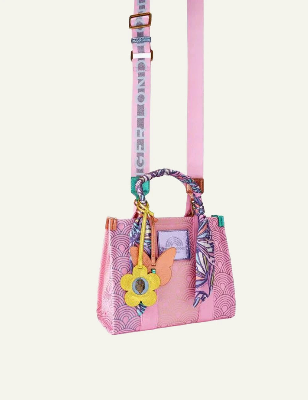 Kurt Geiger tote bag pink canvas pattern scarf handle charm detail side