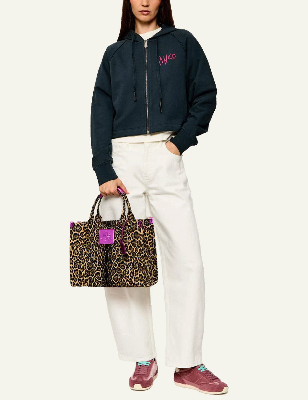 Women's Kurt Geiger Southbank Tote leopard print bag with pink details worn by model