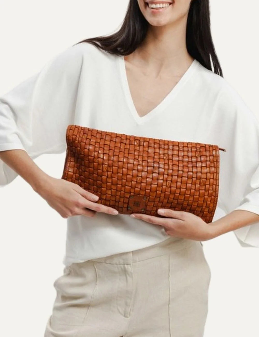 Biba khaki washed leather crossbody bag with hand-braided flap, rectangular silhouette and adjustable strap.