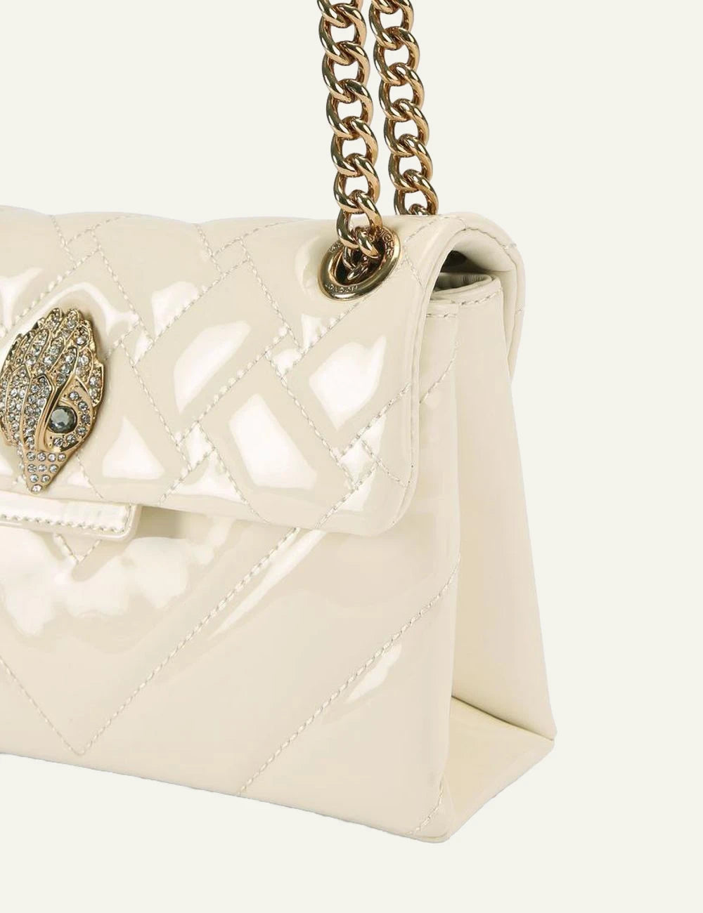 Kurt Geiger mini Kensington cream patent bag angled front view