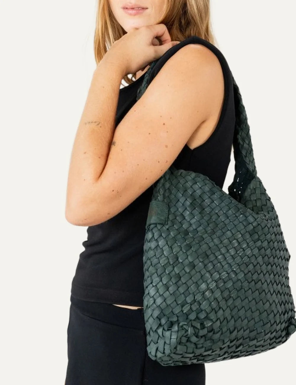 Biba Killen women's dark green woven leather hobo shoulder bag with a slouchy silhouette, braided shoulder strap and seamless woven design model