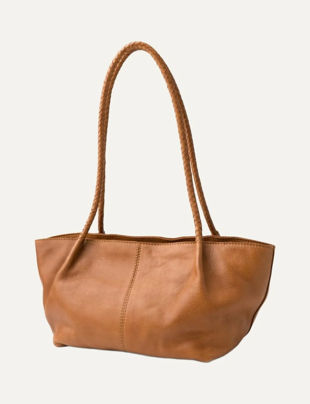 Biba women's tan washed leather baguette shoulder bag with long braided handles, soft curved silhouette and vertical front stitching.