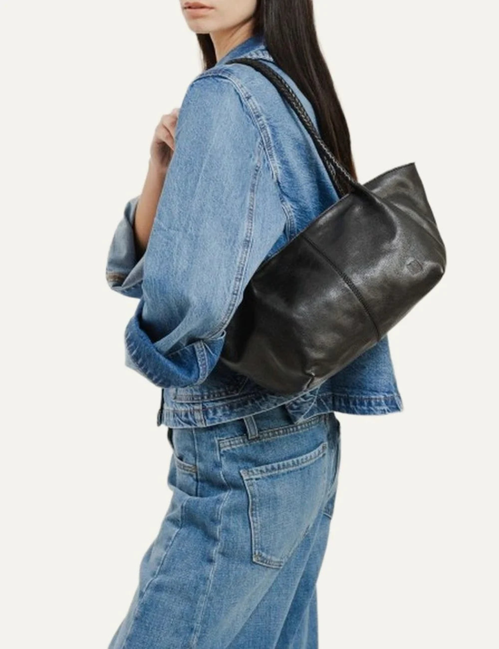 Biba women's black washed leather baguette shoulder bag with long braided handles, curved silhouette and subtle embossed front logo model