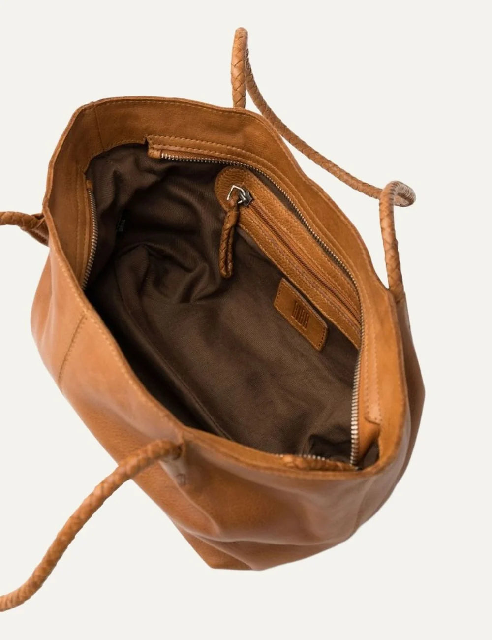 Biba women's tan washed leather baguette shoulder bag with long braided handles, soft curved silhouette and vertical front stitching top