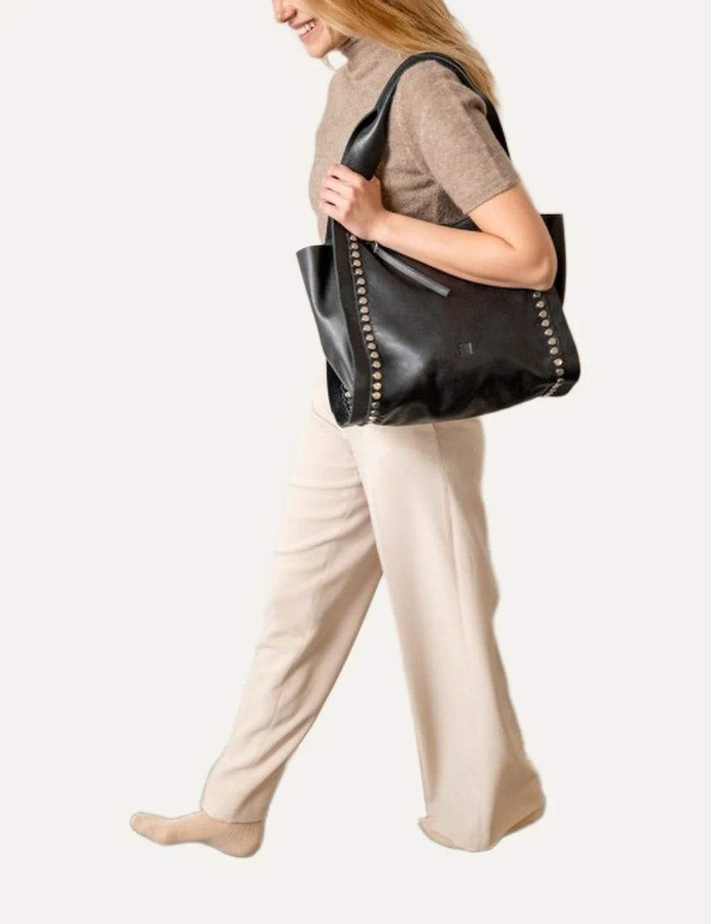 Biba Vienna women's black leather shopper bag with wide shoulder handles, metallic stud detailing along the front edges and a zip closure model
