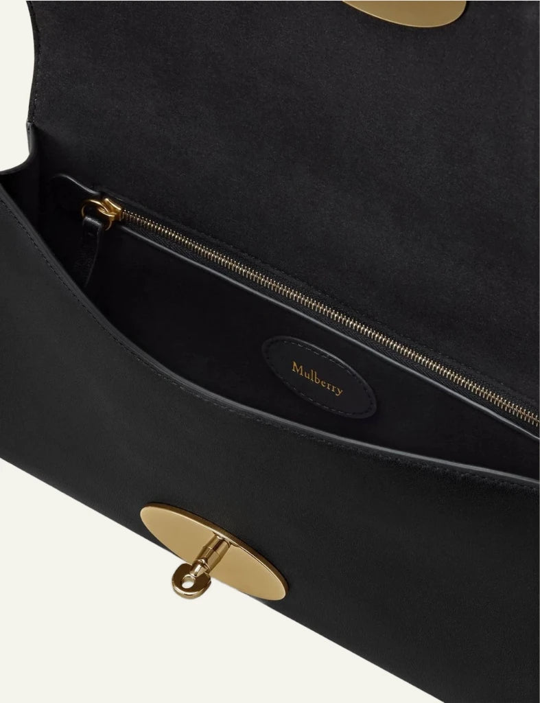 black leather clutch bag gold hardware top view