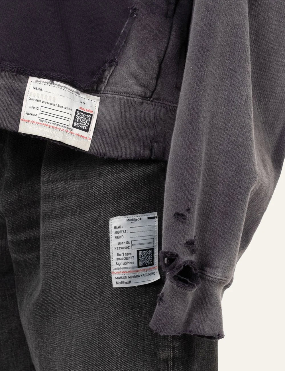 Maison Mihara Yasuhiro hoodie distressed fabric holes label detail