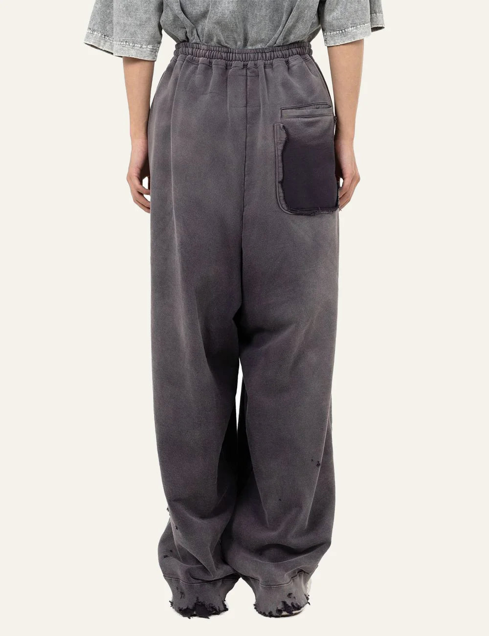 Maison Mihara Yasuhiro sweat pants back view torn pocket washed grey