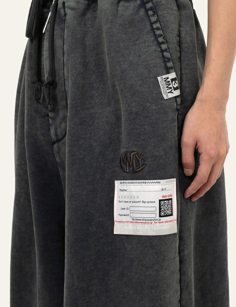 Maison Mihara Yasuhiro sweat pants logo label detail distressed design
