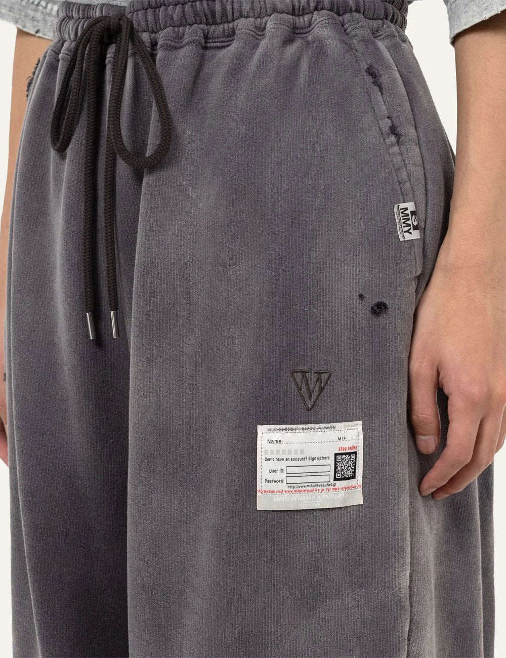 Maison Mihara Yasuhiro sweat pants embroidered logo patch detail