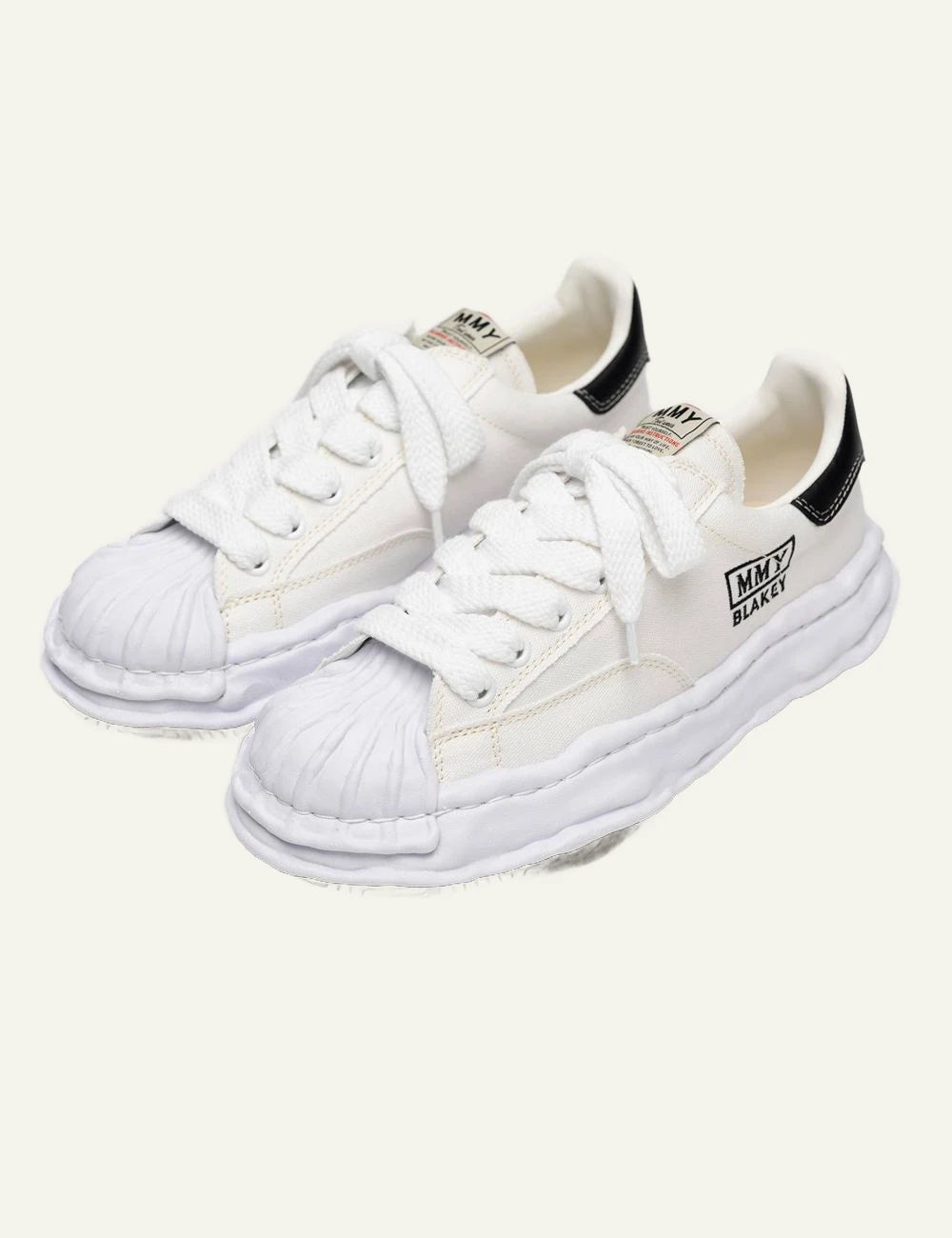 Maison Mihara Yasuhiro Blakey White Canvas Low Top Sneaker pair View