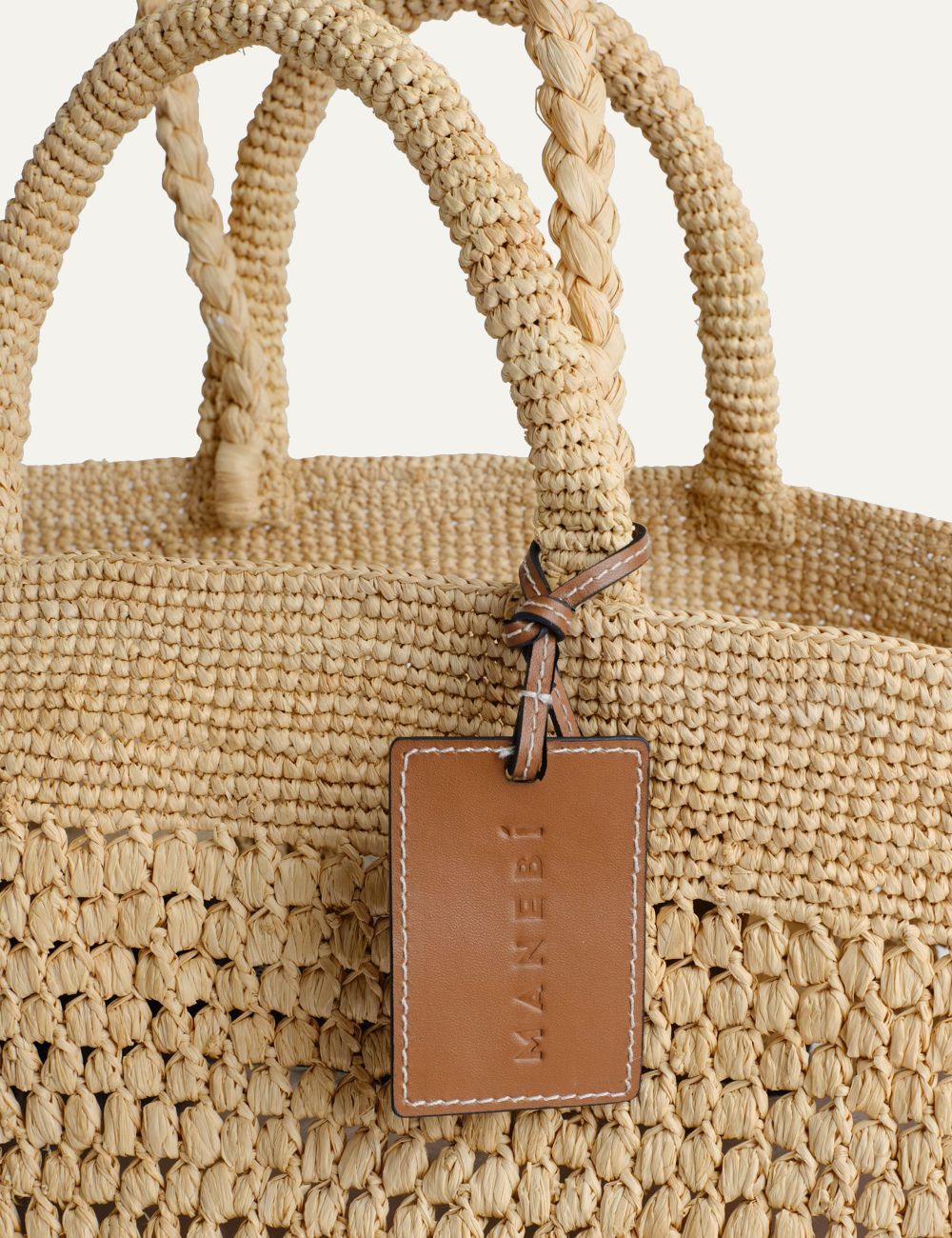 Manebi Fiji raffia bag natural woven tote front detail view