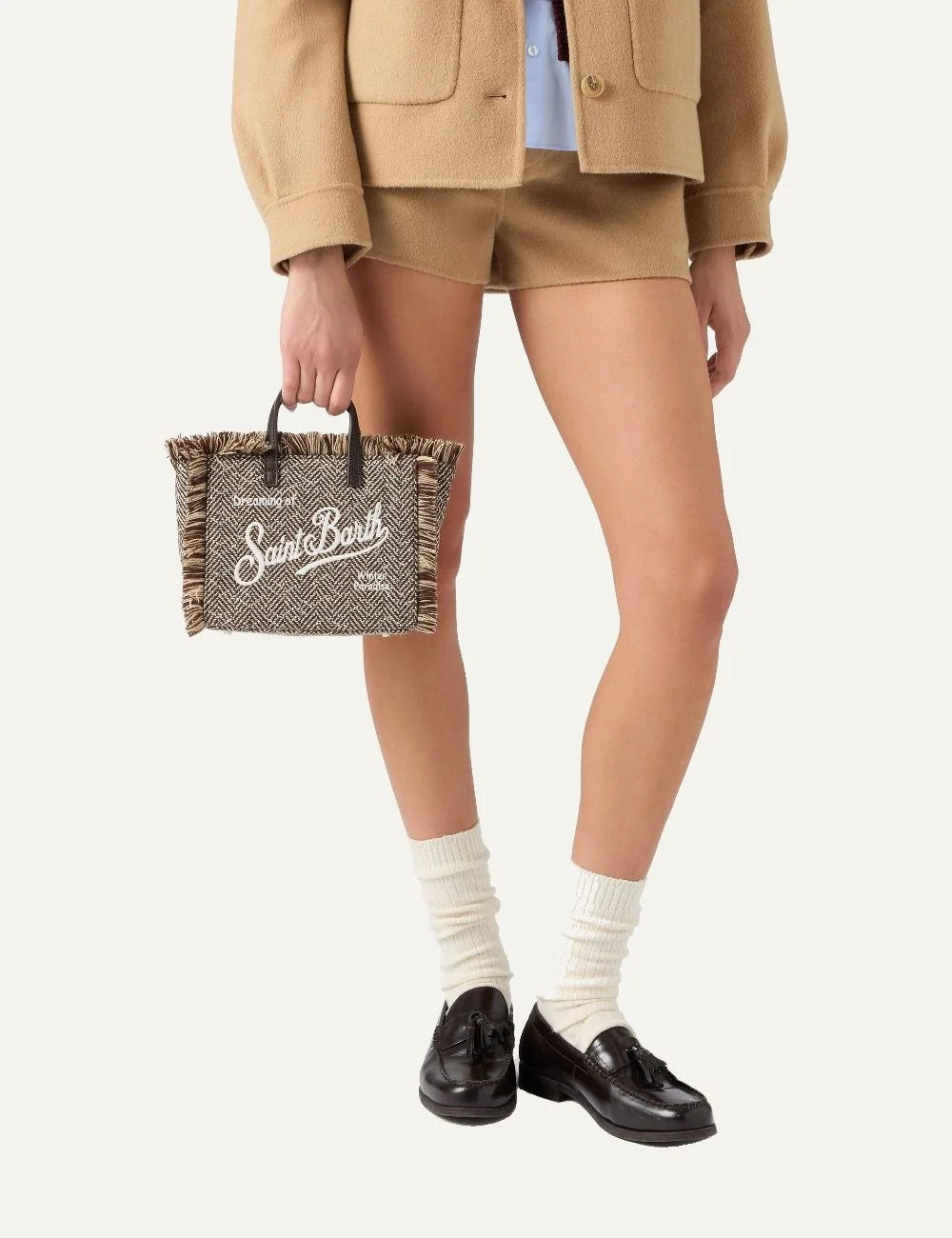 Women's MC2 Saint Barth Mini Vanity bag in brown and beige wool blend with herringbone pattern, fringed edges, Saint Barth embroidery and rhinestone details model