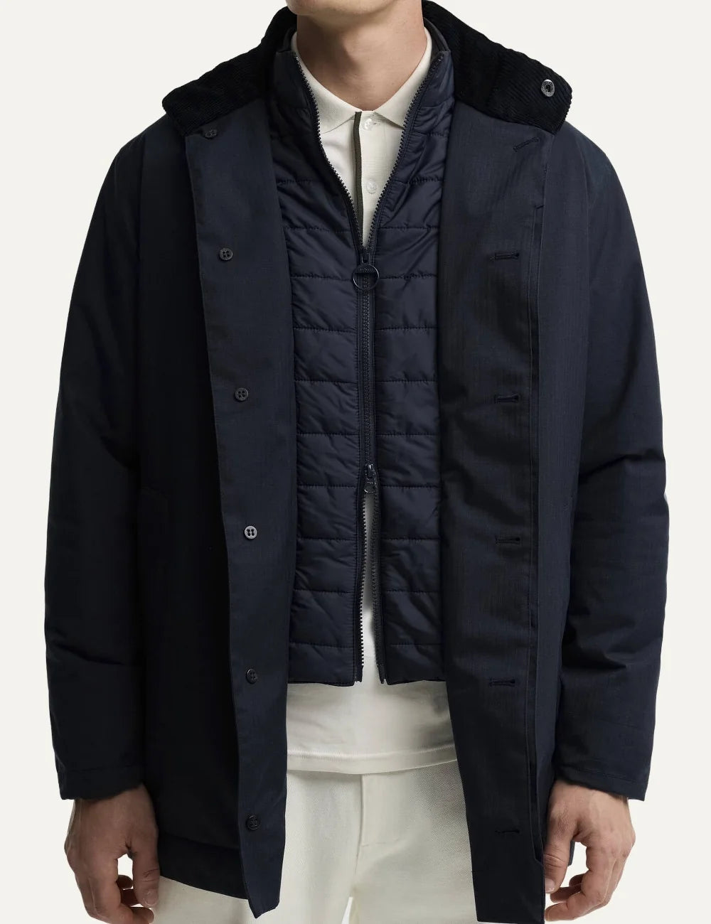 Men's Barbour Northdale navy waterproof mac coat with brushed herringbone finish, quilted wind guard and concealed button fastening front  view details