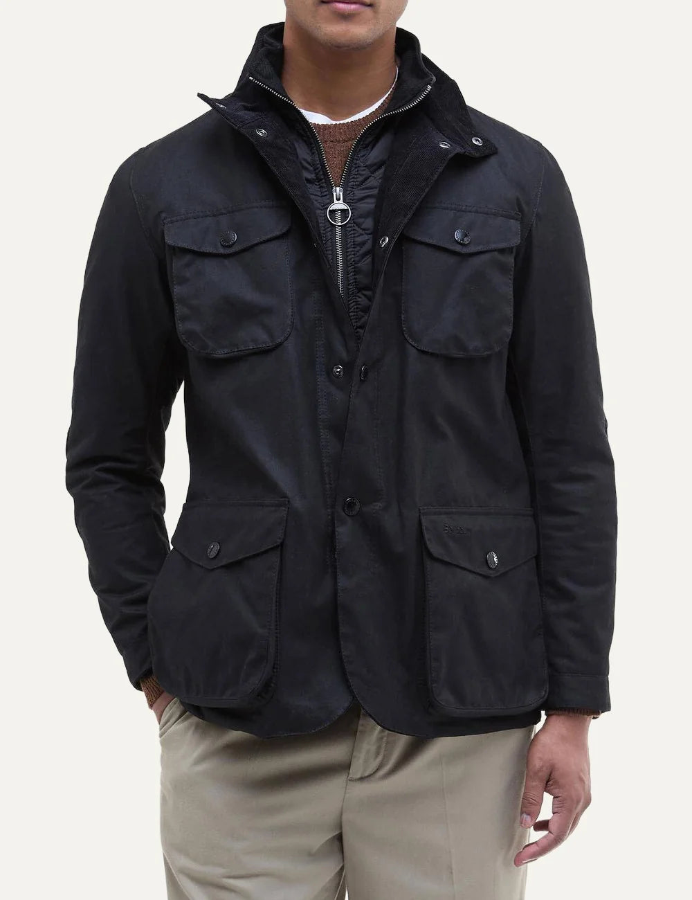 Men's Barbour Ogston black heavyweight waxed cotton jacket with quilted inner vest, stand collar, four utility pockets and leather elbow patches front view