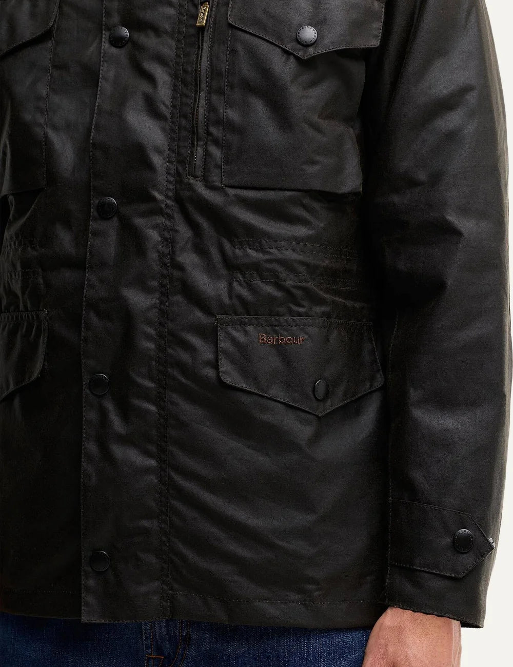 Men's Barbour Sapper dark olive Sylkoil waxed cotton jacket with four pockets, drawcord waist, quilted lining and stowaway waterproof hood close up details