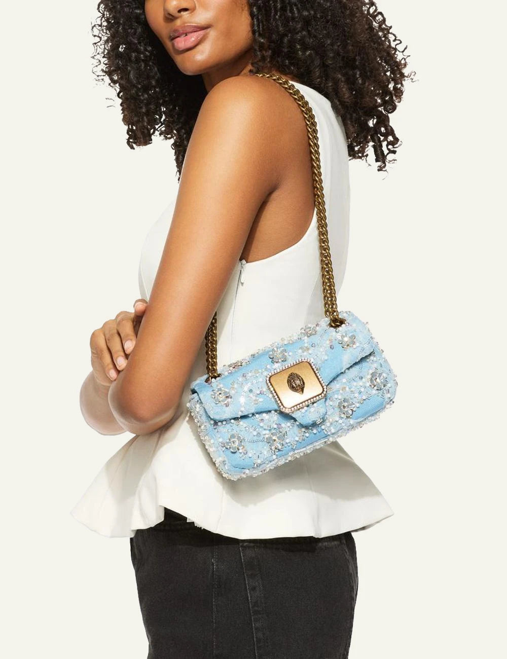Kurt Geiger London Mini Pimlico blue beaded bag worn on model side view