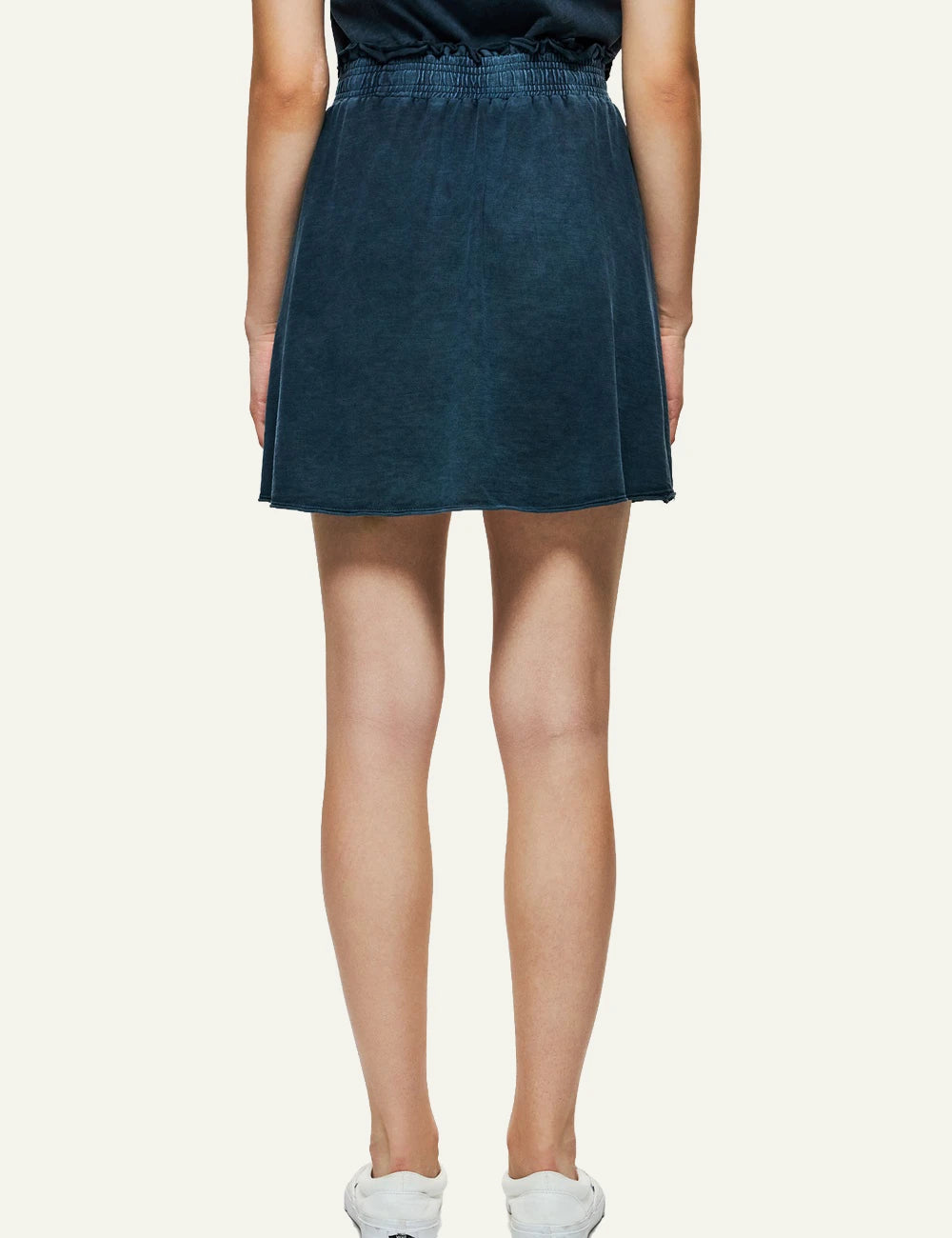 dark blue mini skirt raw edges elastic waist casual fit back view.