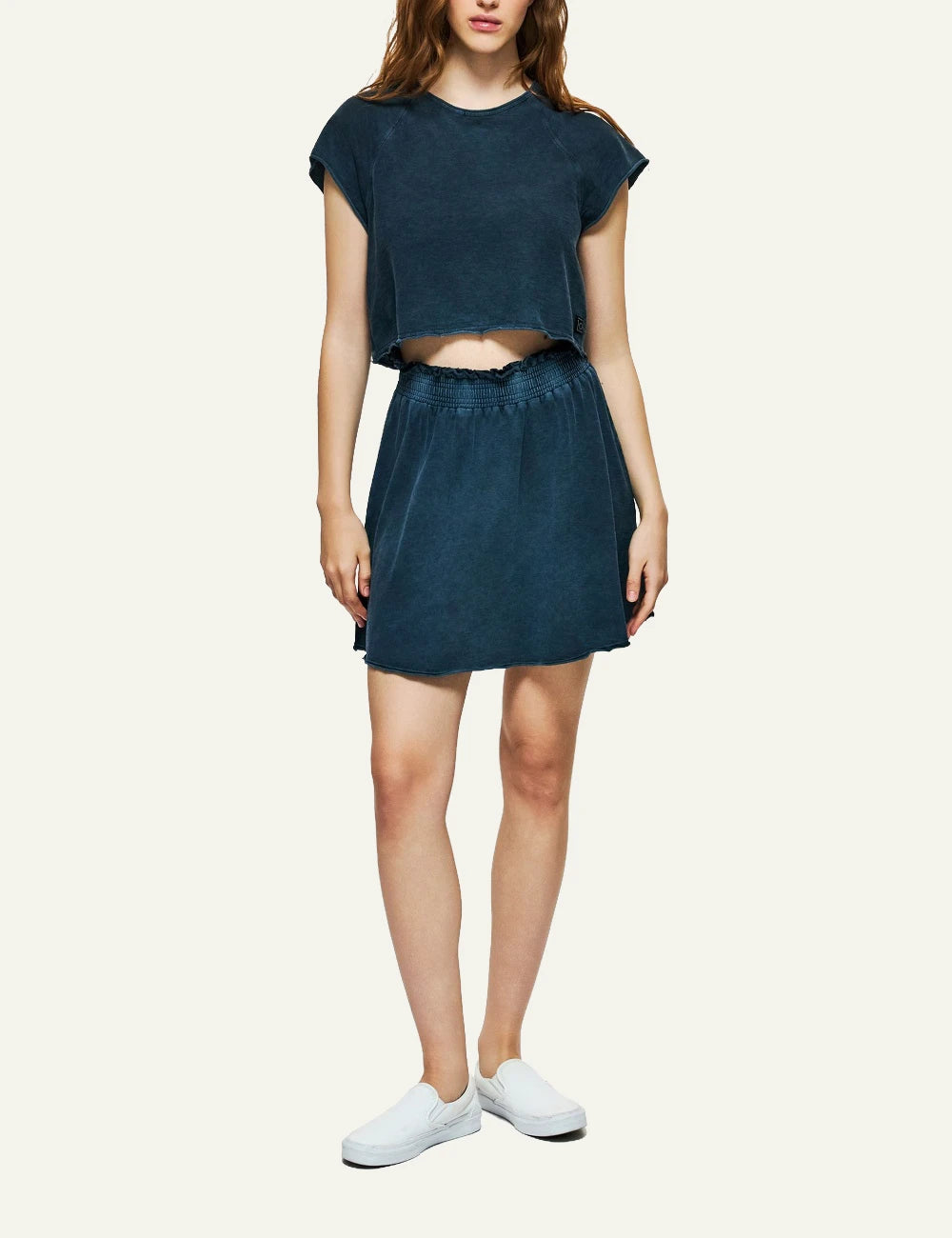 dark blue mini skirt raw edges elastic waist casual fit full body view.