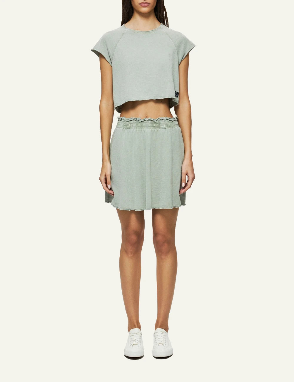 light green mini skirt raw edges elastic waist casual fit full model view