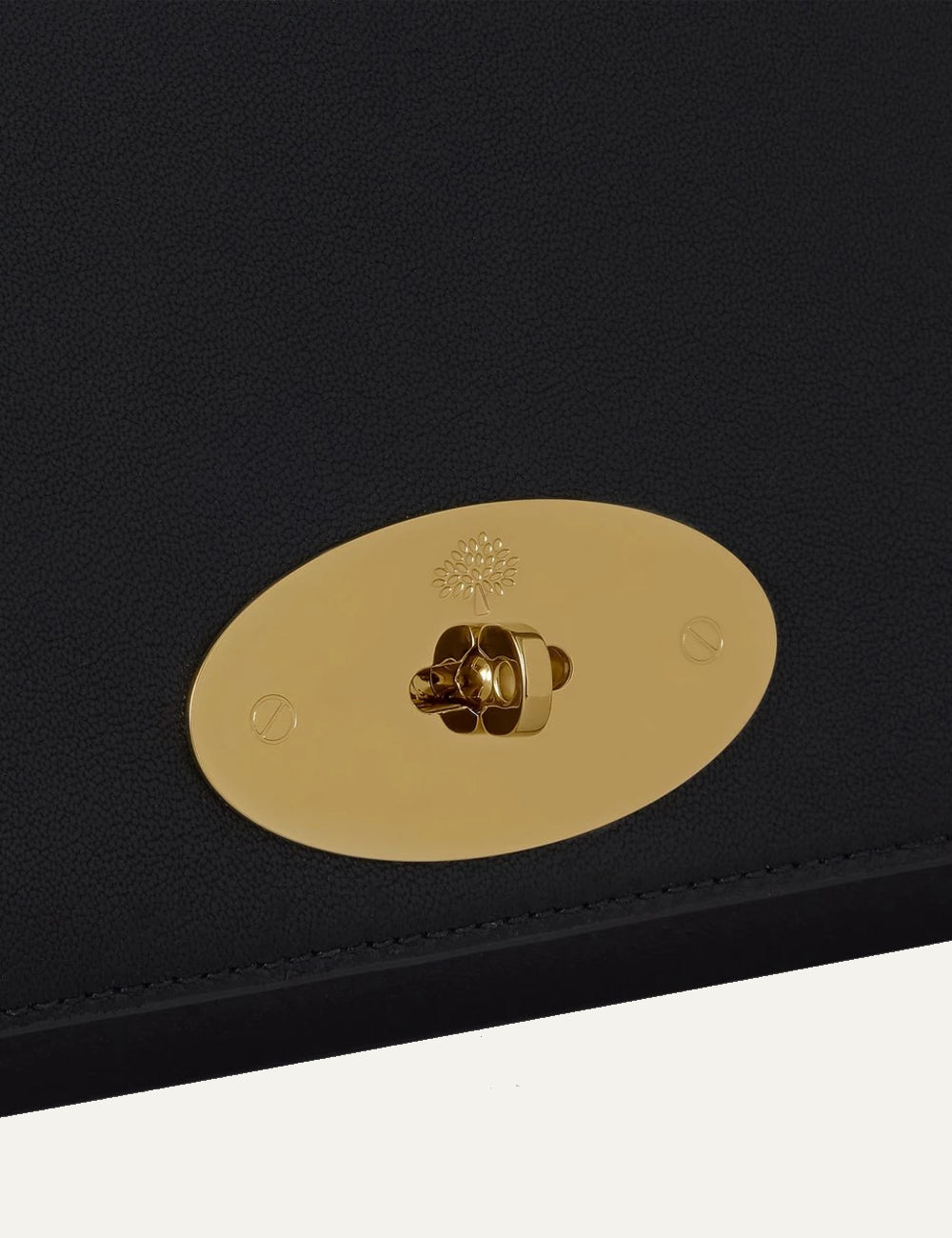 black leather clutch bag gold hardware front detail view