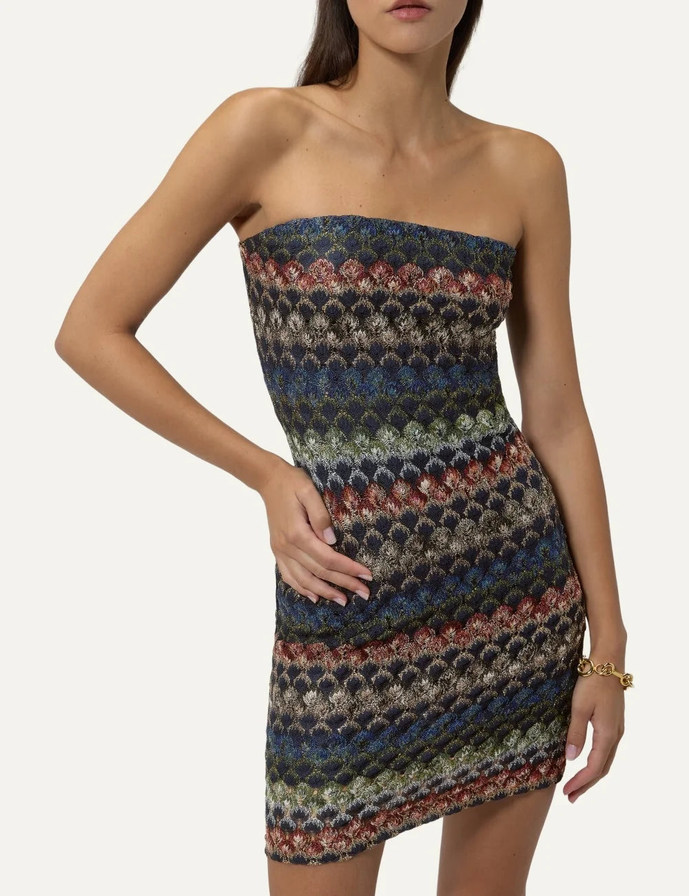 Missoni women's multicolor strapless mini dress with a structured bustier silhouette and intricate geometric lace knit pattern in blue, burgundy, green and beige tones model