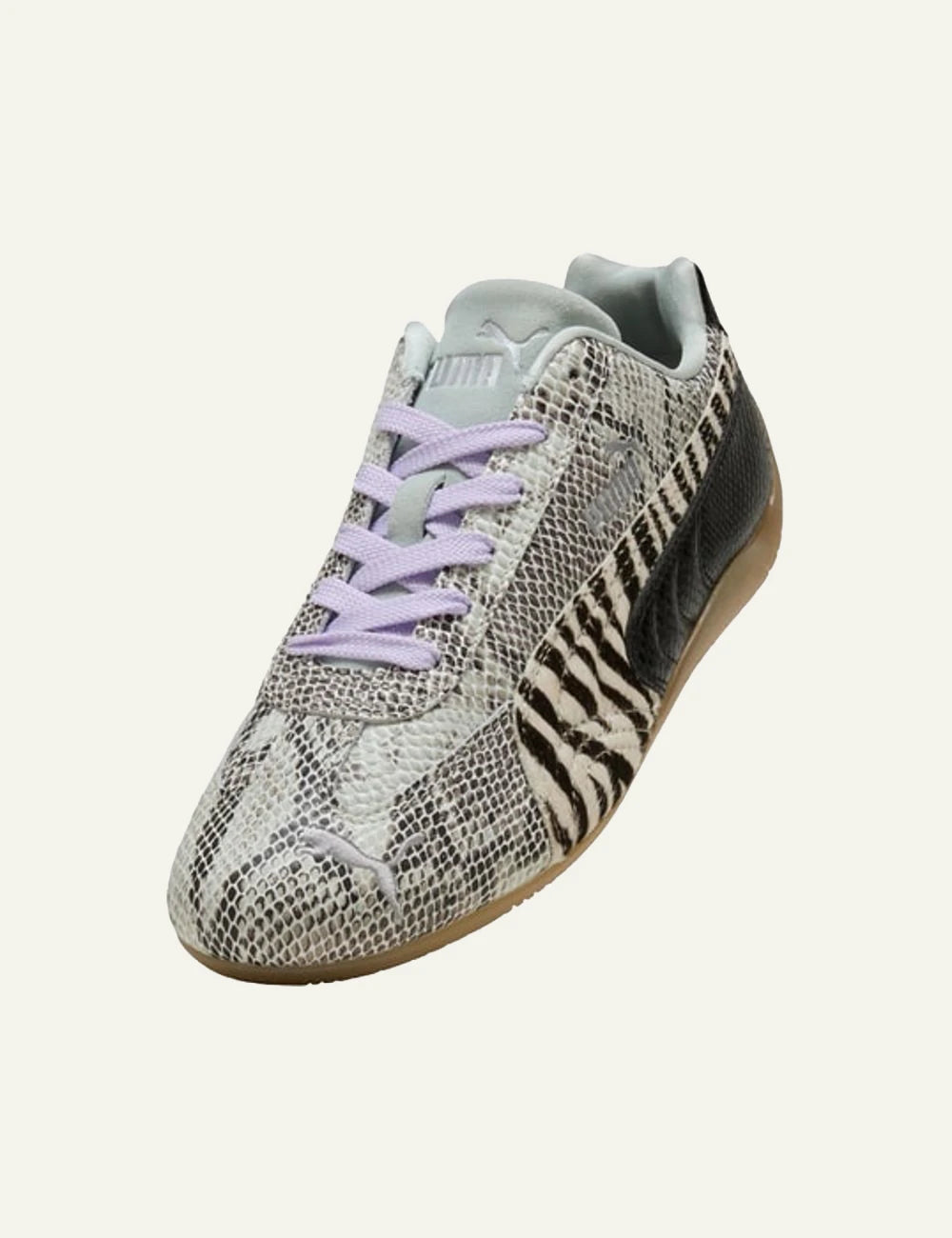Mixed animal print sneakers with zebra and snake pattern angled view 