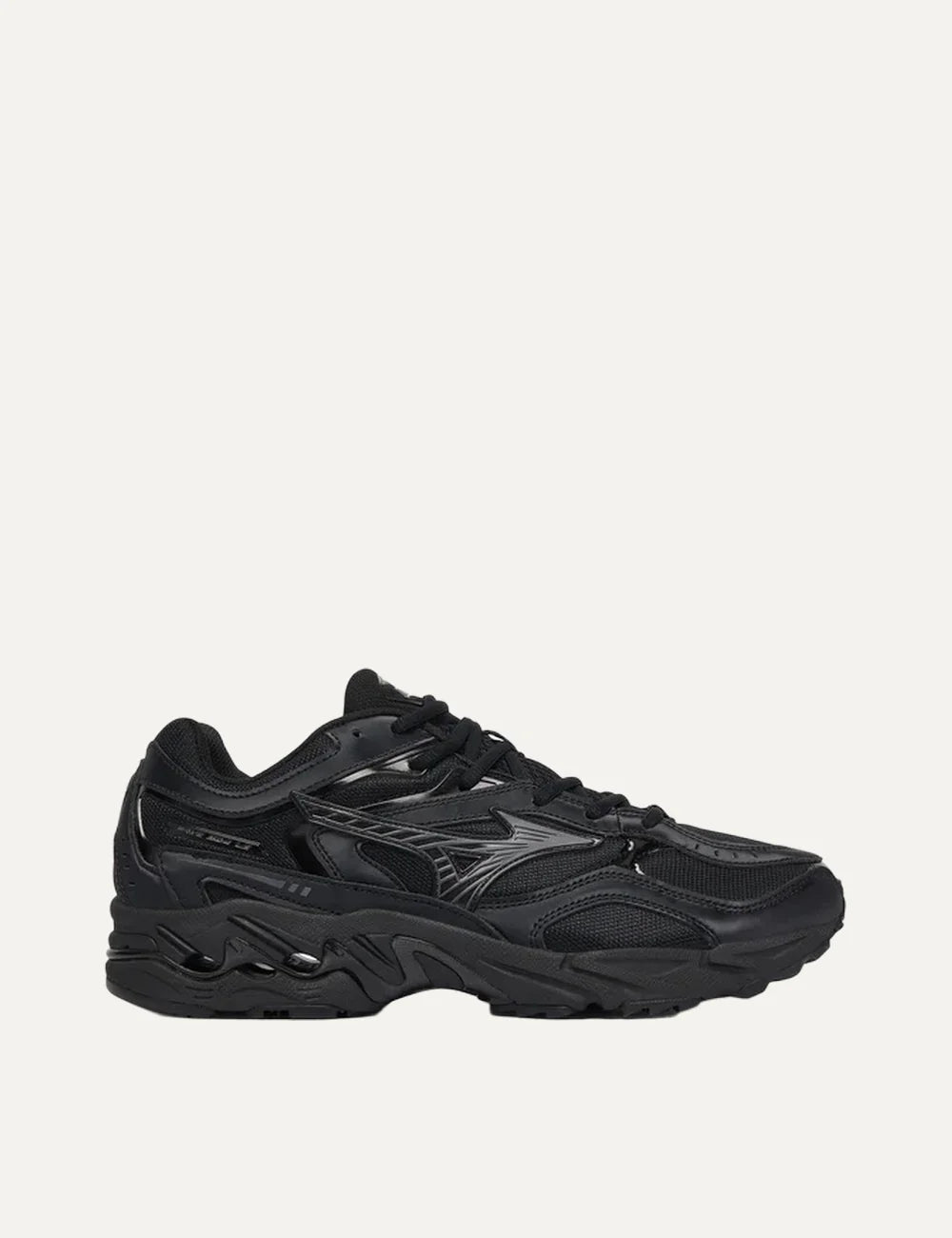 Mizuno Wave Mustang LS Tech black sneakers with mesh panels, metallic grey overlays, lace-up fastening and sculpted chunky sole.