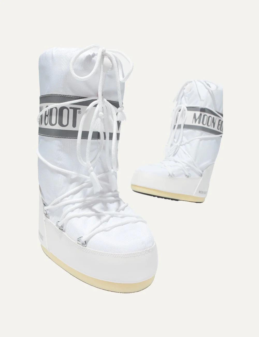 Moon Boot women Icon white nylon boots with logo panel and criss-cross laces pair view