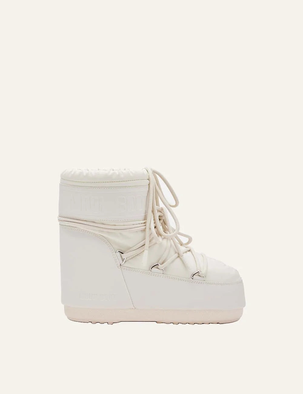 Moon Boot women Icon Low cream rubber boots with criss-cross laces and embossed logo details side view