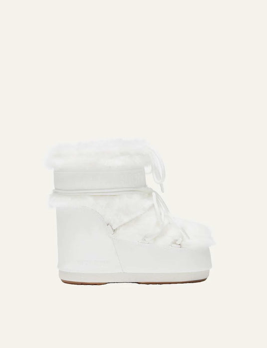 Moon Boot women Icon Low white faux fur boots with criss-cross laces and logo details side view