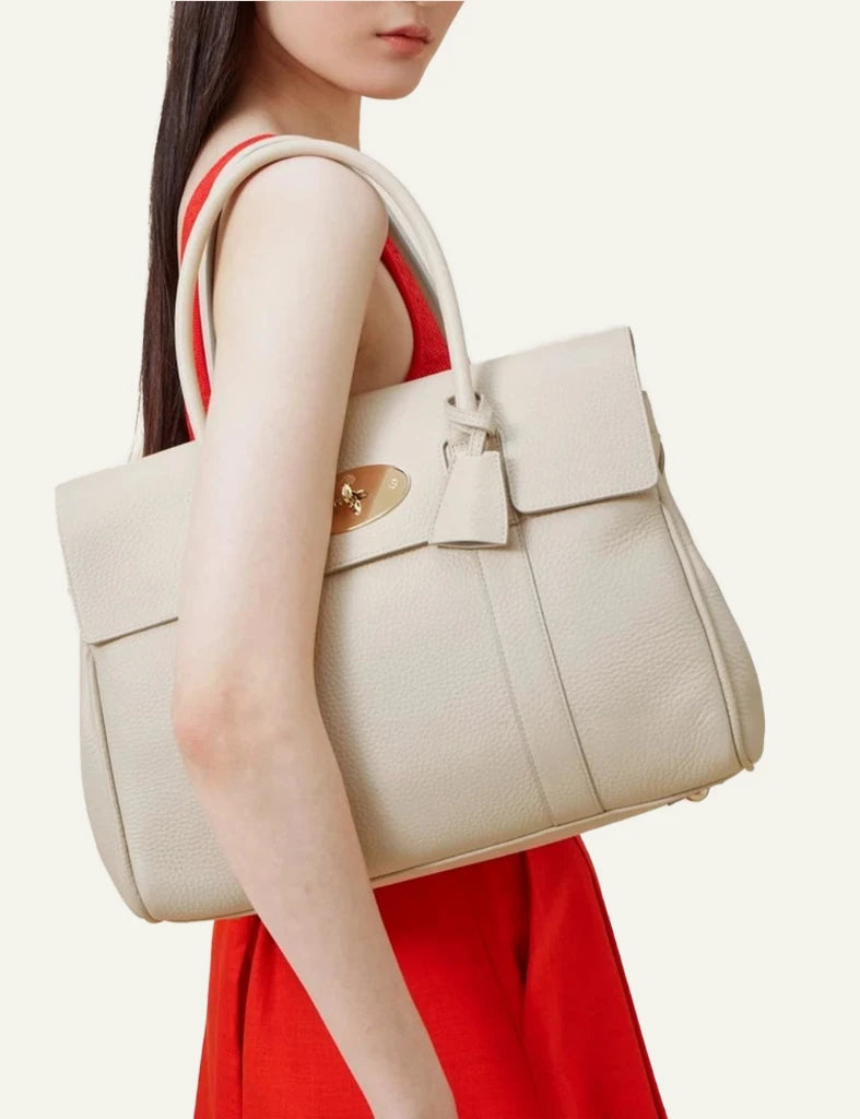 mulberry leather top handle bag postmans lock gold front model view