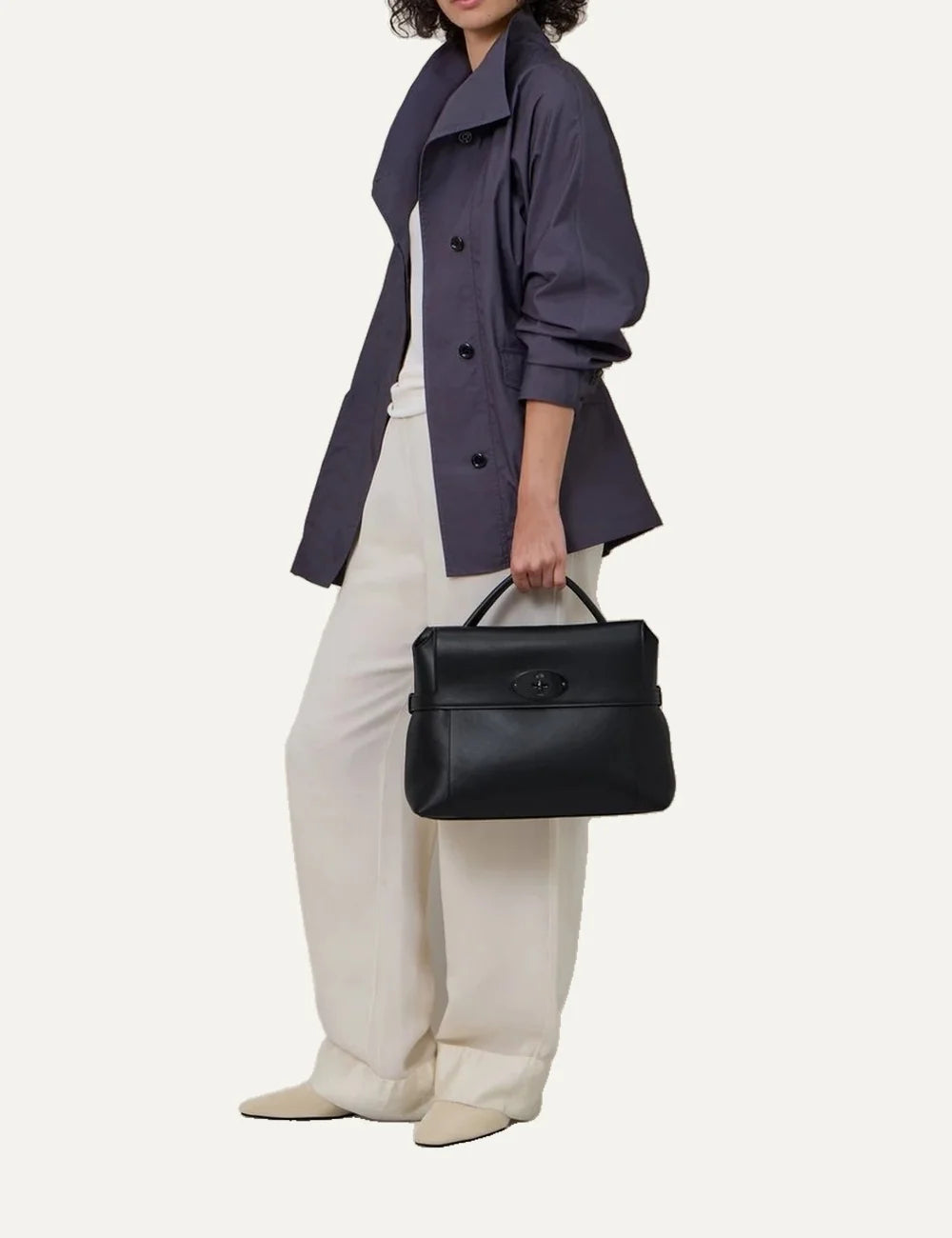 Mulberry women's black top handle bag with structured silhouette, detachable shoulder strap, front flap pocket and tonal Postman's Lock hardware full body