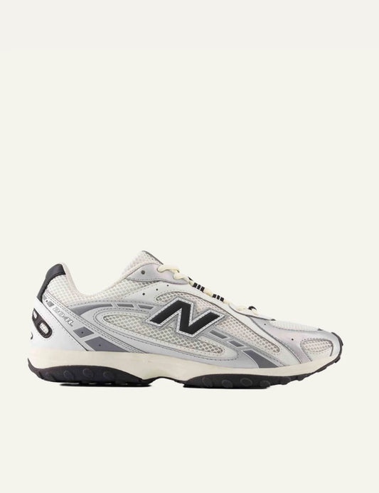 New Balance 204L women's white low profile sneakers with silver details side view