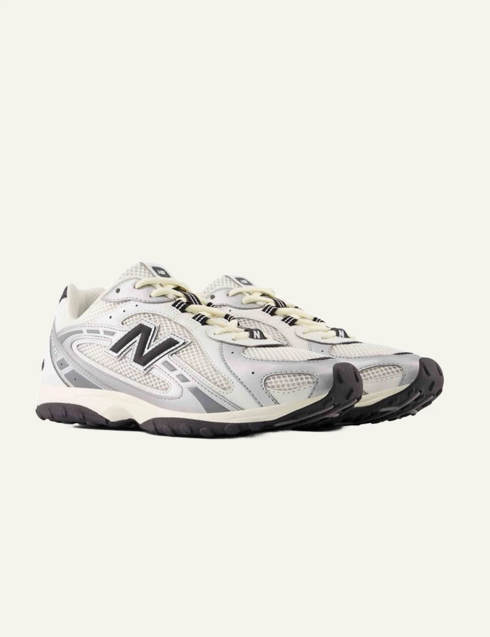New Balance 204L women's white low profile sneakers with silver details pair view