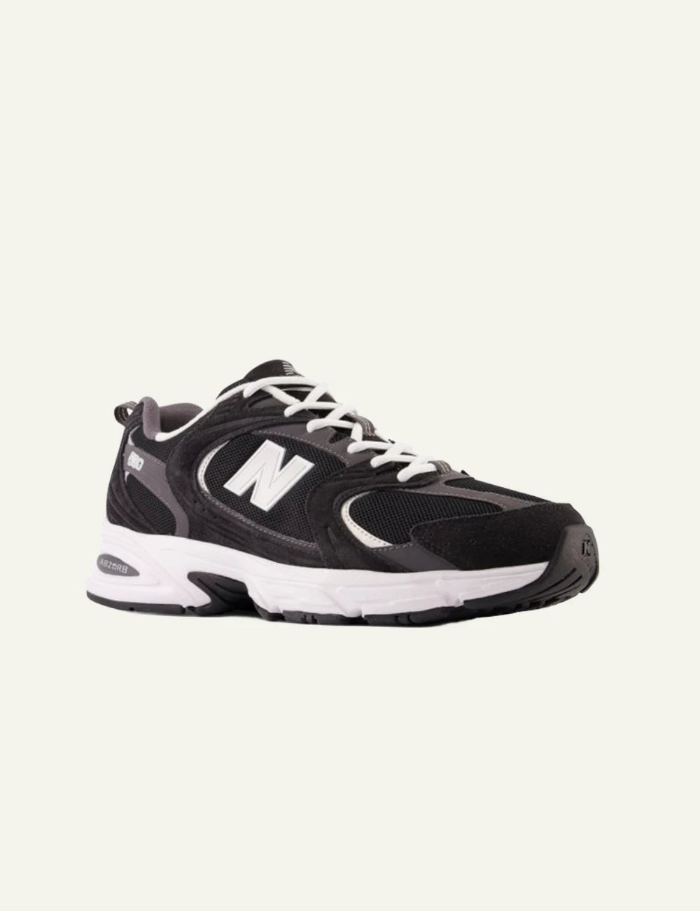 New Balance 530 women's black mesh and suede sneakers front angle view 