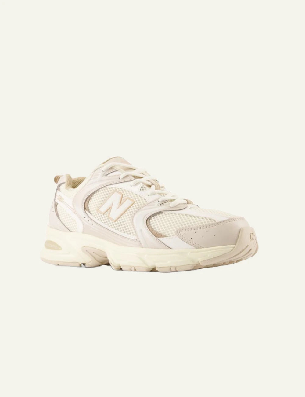 New Balance 530 women's cream mesh sneakers with beige details front angle view