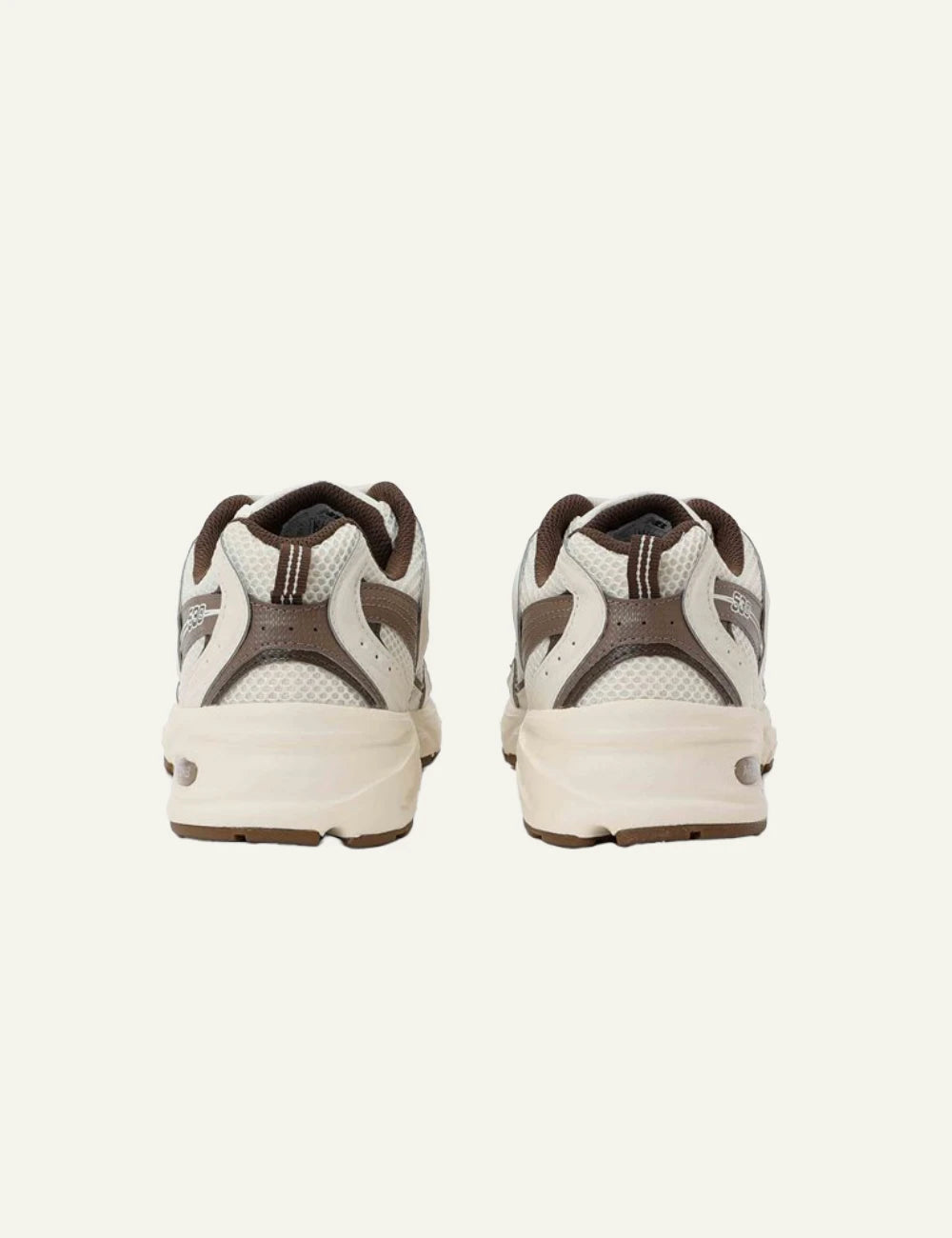 New Balance 530 women's cream mesh sneakers with taupe details back view