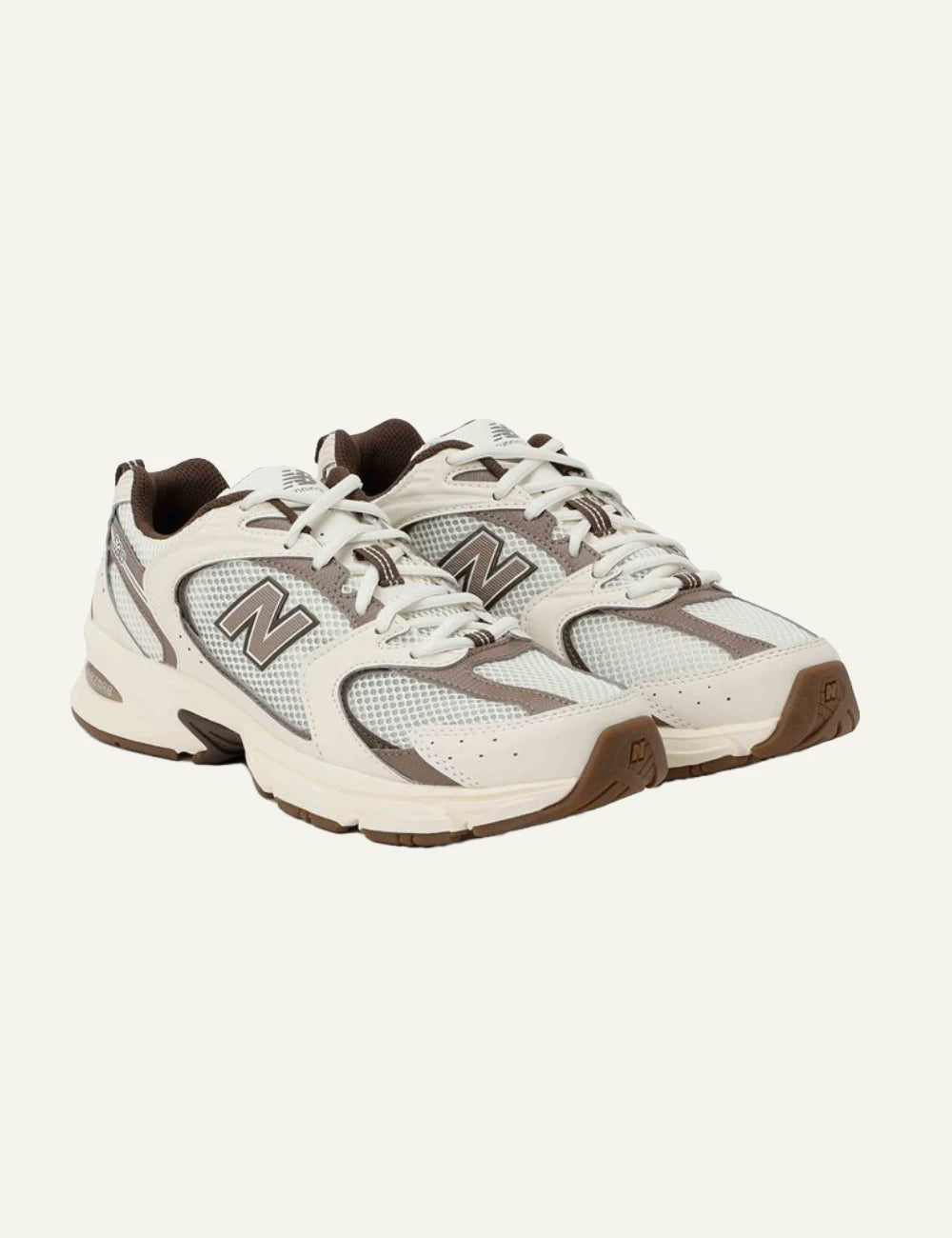 New Balance 530 women's cream mesh sneakers with taupe details pair view