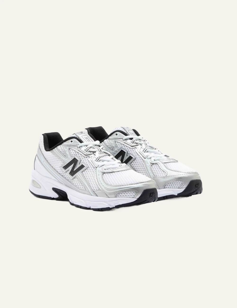 New Balance 740 women's white mesh sneakers with silver and black details pair view