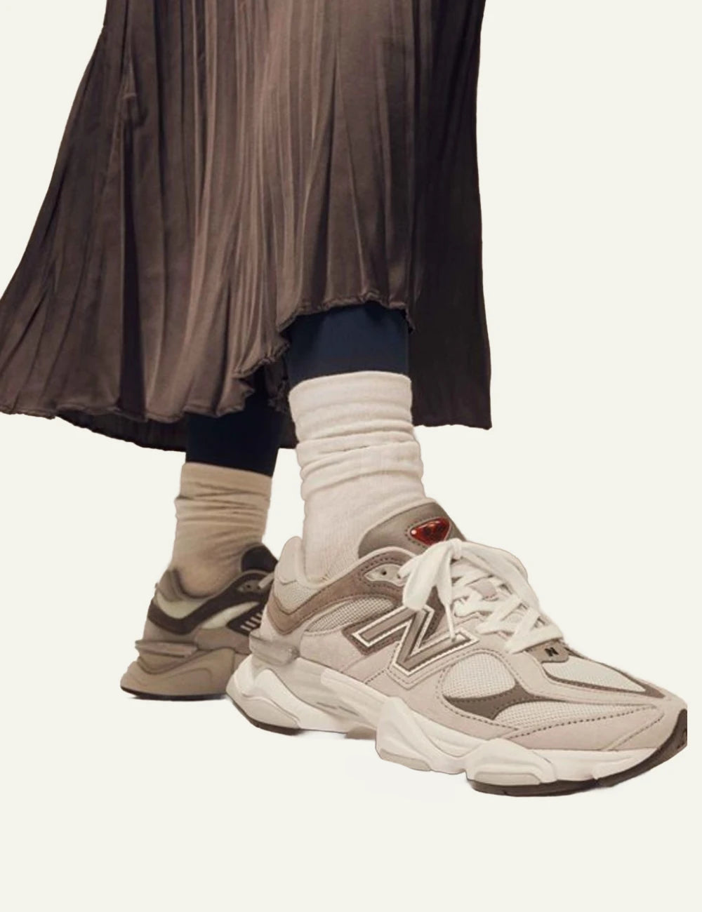 New Balance 9060 women's grey suede and mesh sneakers worn by model