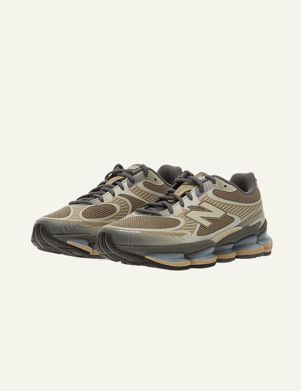 New Balance ABZORB 2010 sneakers beige brown blue sole mesh angled view