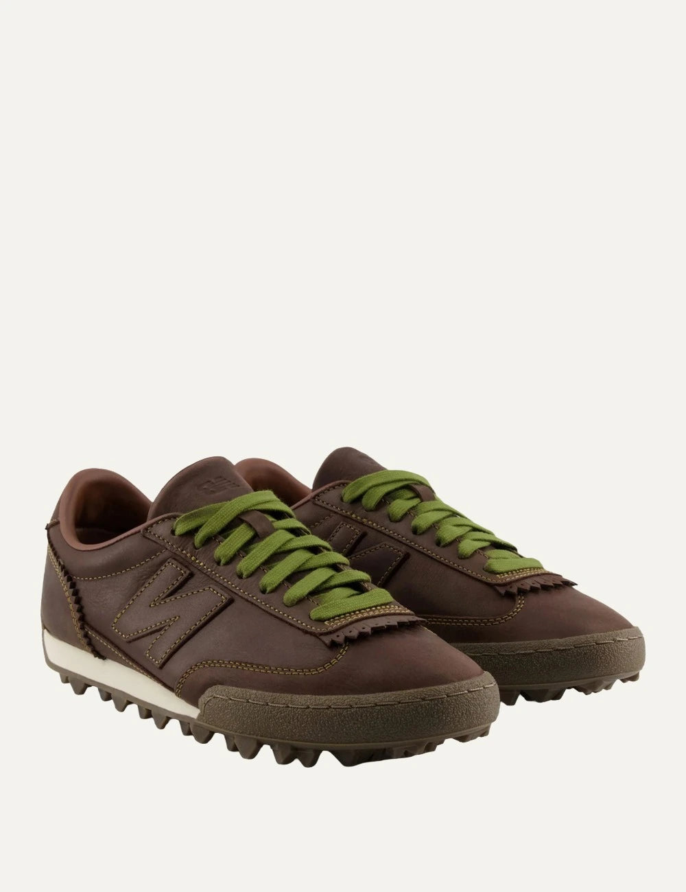 New Balance Gator Run women's dark brown leather sneakers with green laces pair view