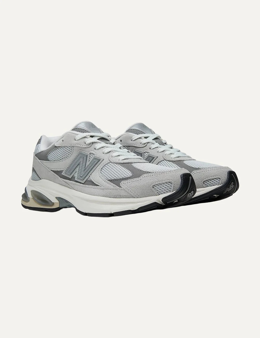 New Balance unisex light grey suede mesh sneakers with ABZORB cushioning angled